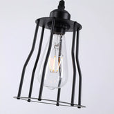 Vintage industrial pendant light illuminating a modern kitchen island